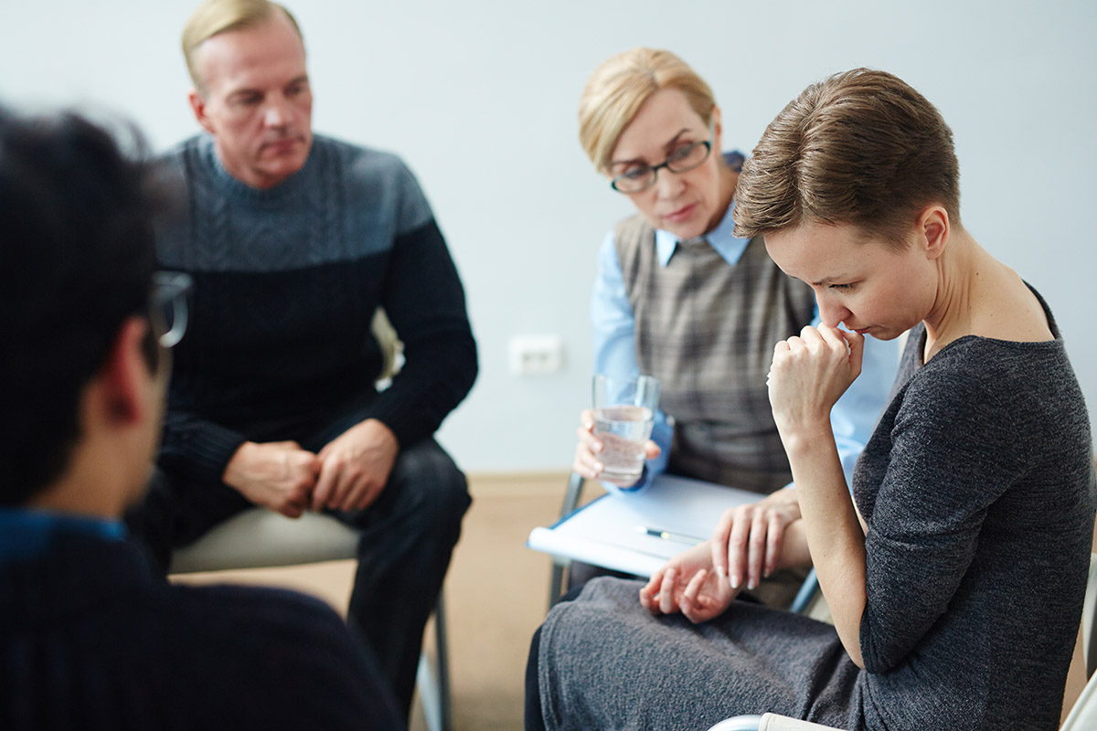 detox sets the tone for emotional woman during group therapy