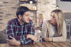 Man talking to woman about Tallahassee substance abuse statistics