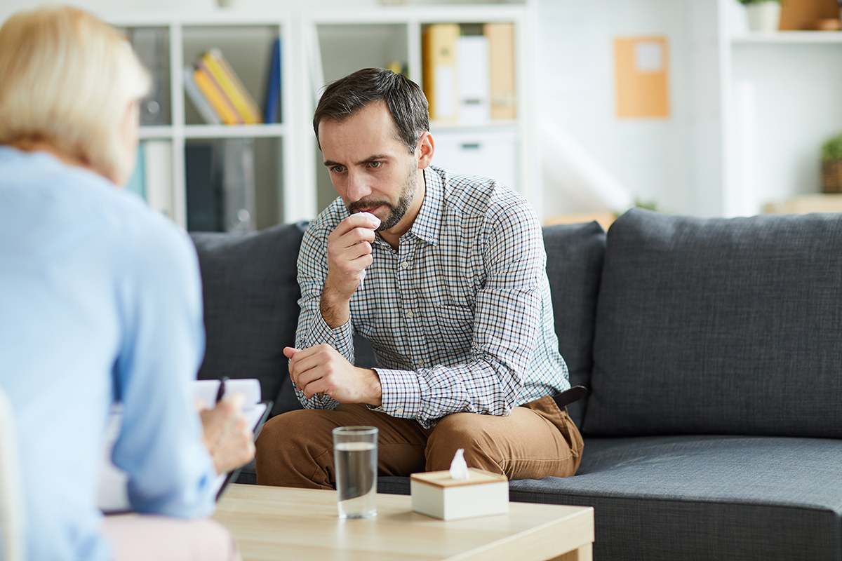 male patient asks female therapist taking notes can tms therapy treat depression and anxiety