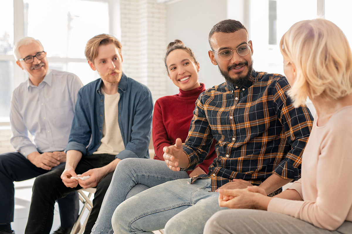 the 12 step program, group of people talking in therapy