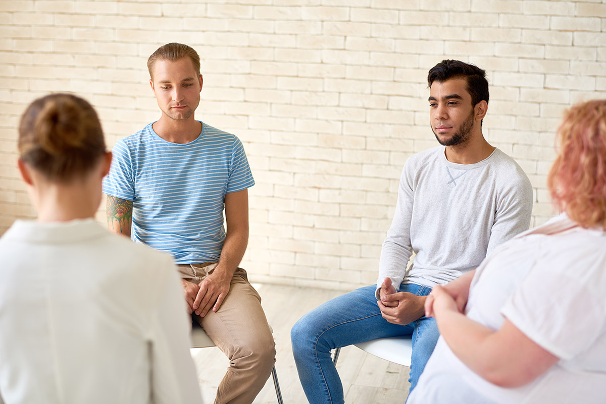 support group meeting going over how to begin addiction treatment