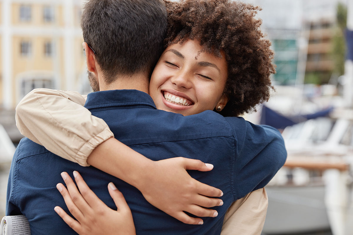 sister hugging a Loved One Returning From Addiction Treatment