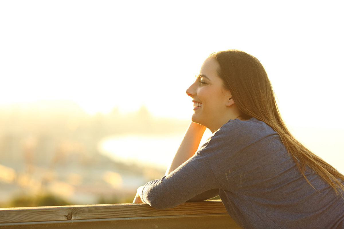 happy woman practicing healthy coping skills