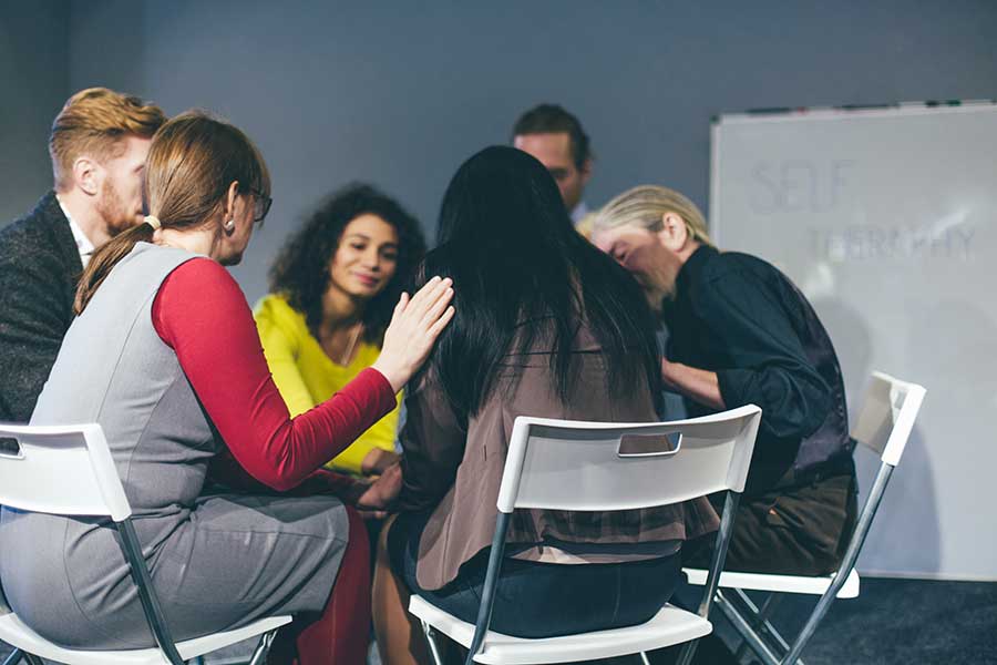 group discussing with a woman signs you need rehab now